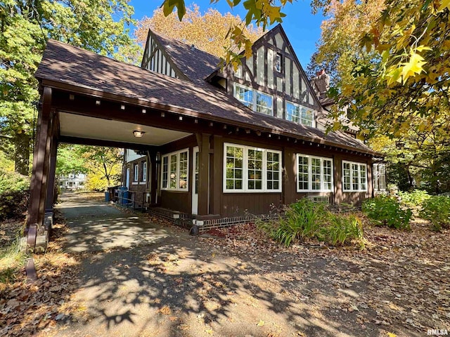 view of property exterior featuring a carport