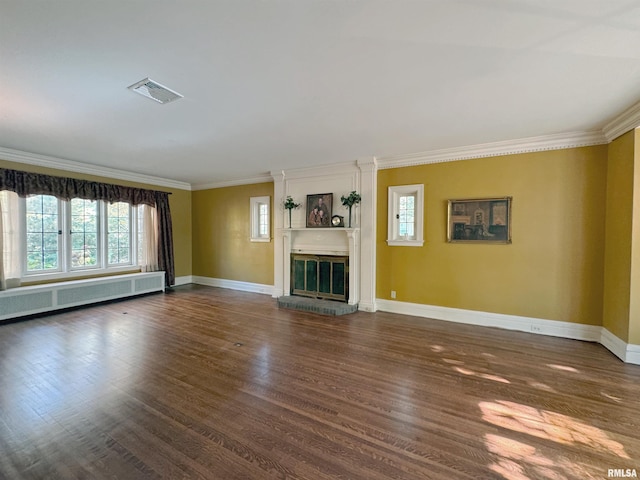 unfurnished living room featuring ornamental molding, radiator, and dark wood-type flooring