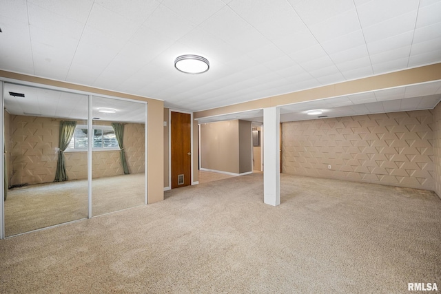 basement featuring carpet flooring