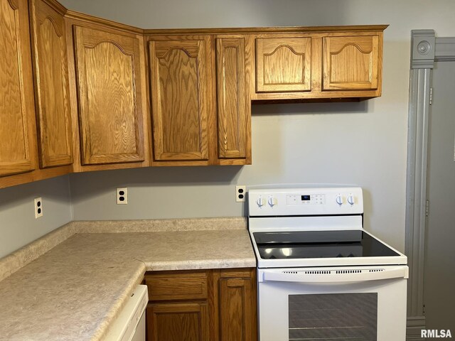 kitchen with hanging light fixtures, ceiling fan, vaulted ceiling, dishwasher, and sink