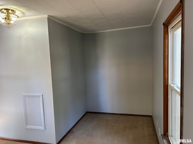 unfurnished room featuring light carpet and ornamental molding