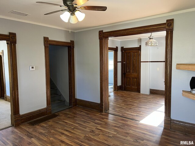 carpeted entrance foyer with ornamental molding