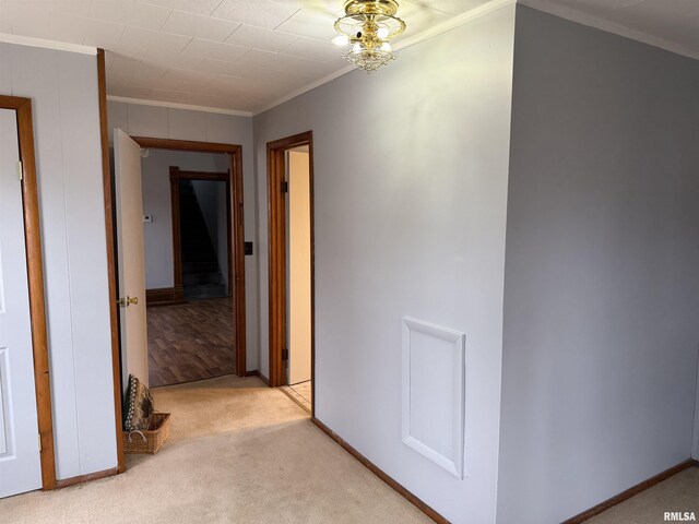 spare room with crown molding, carpet, and plenty of natural light