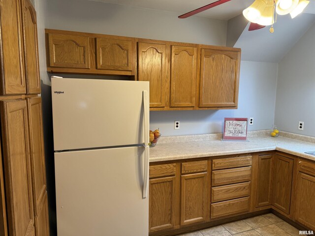 kitchen with sink, pendant lighting, and white appliances