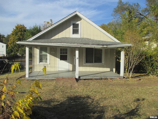 rear view of house with covered porch