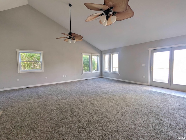 carpeted spare room featuring high vaulted ceiling, ceiling fan, and baseboards