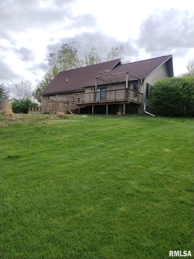 back of house with a yard and a wooden deck