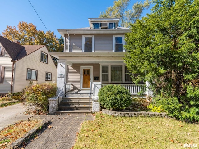 view of front of home featuring a porch and a front yard