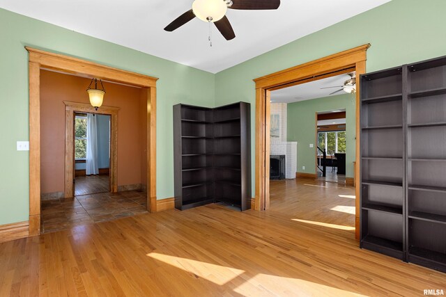 unfurnished room featuring hardwood / wood-style flooring and ceiling fan