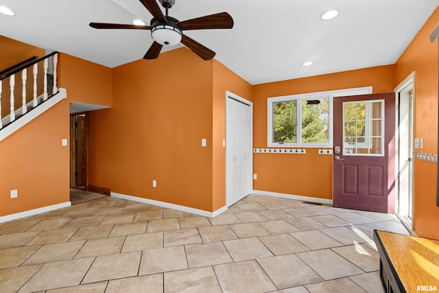 tiled entrance foyer with ceiling fan