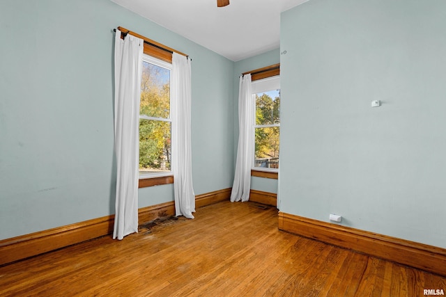 unfurnished room with light hardwood / wood-style floors