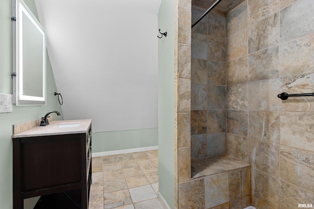 bathroom featuring vanity and a tile shower