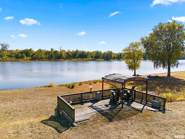 exterior space featuring a gazebo and a deck with water view