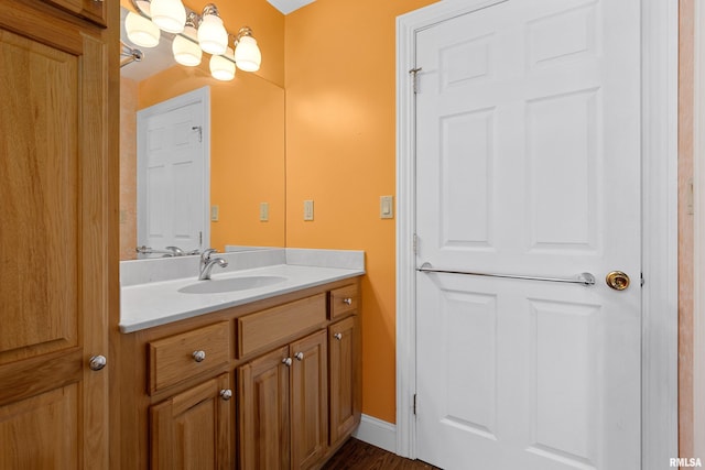 bathroom featuring vanity and hardwood / wood-style floors