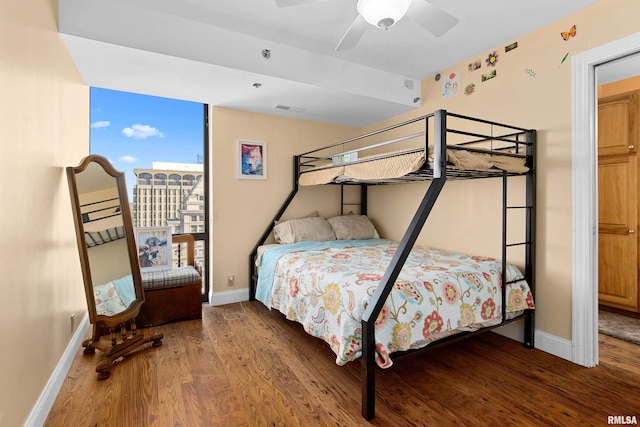 bedroom featuring ceiling fan and hardwood / wood-style flooring