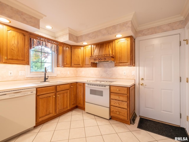 kitchen featuring sink, crown molding, white appliances, light tile patterned floors, and custom exhaust hood