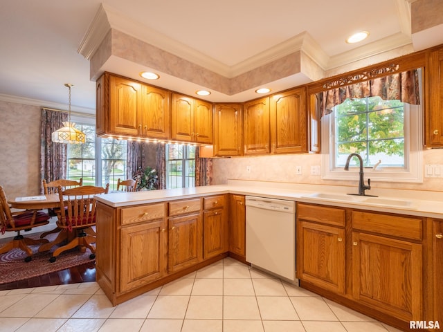 kitchen featuring dishwasher, crown molding, sink, decorative light fixtures, and kitchen peninsula