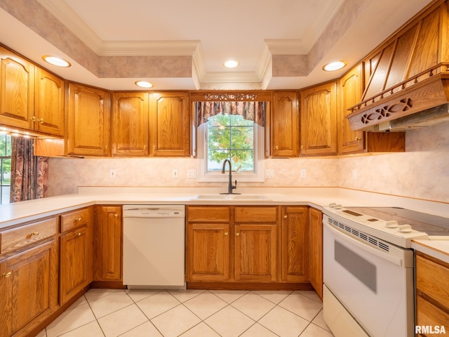 kitchen featuring sink, a healthy amount of sunlight, white appliances, and ornamental molding