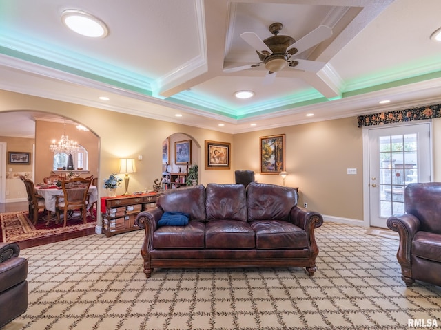 carpeted living room with beam ceiling, ceiling fan with notable chandelier, crown molding, and coffered ceiling