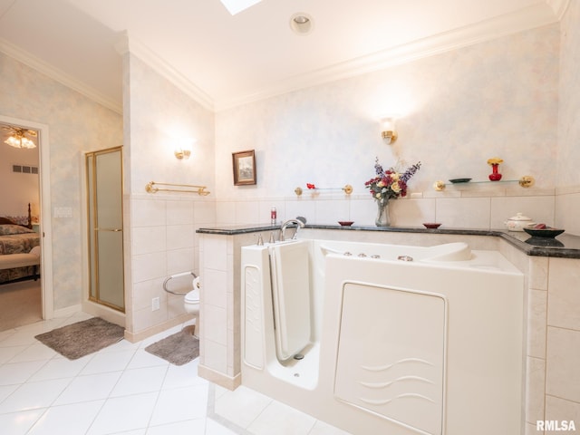 bathroom with tile patterned flooring, vaulted ceiling, toilet, tile walls, and ornamental molding