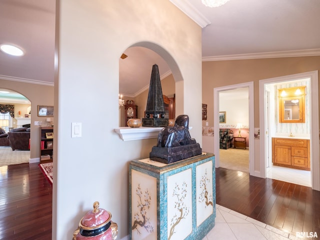 hallway featuring crown molding and wood-type flooring