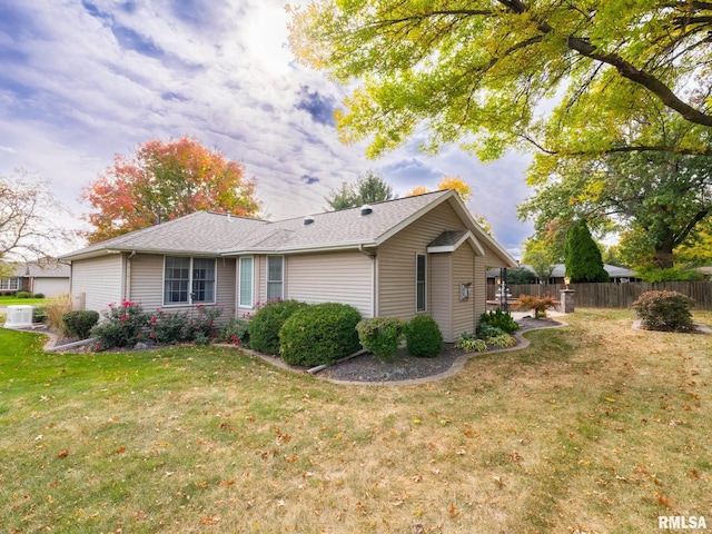 view of side of property featuring a yard