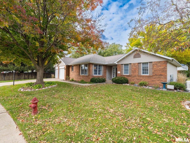 single story home featuring a front yard and a garage