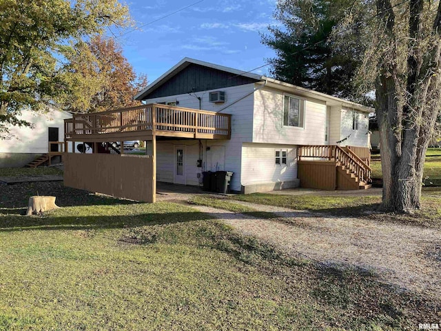 back of house featuring a yard and a deck