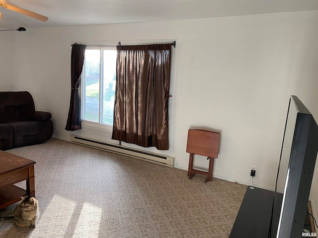 living room featuring ceiling fan, light colored carpet, and a baseboard radiator