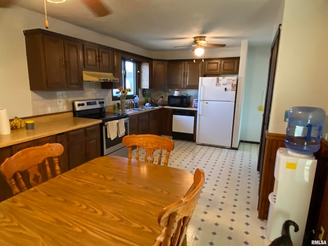 kitchen featuring white appliances, dark brown cabinetry, and ceiling fan