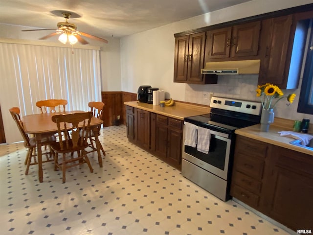 kitchen featuring dark brown cabinets, tasteful backsplash, ceiling fan, and stainless steel electric range