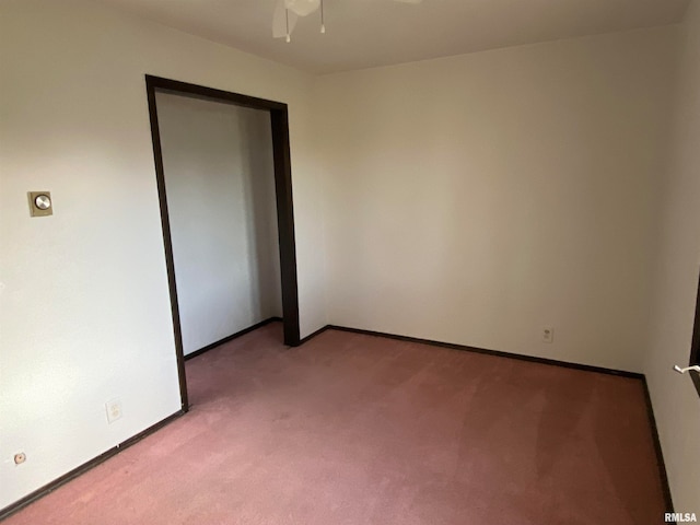 unfurnished room featuring ceiling fan and light colored carpet