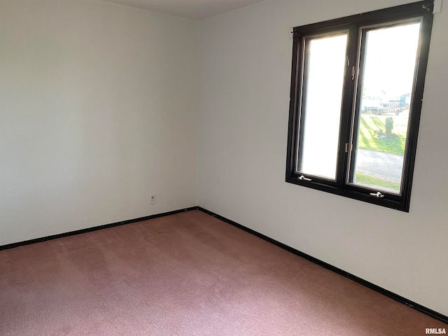 empty room with carpet flooring