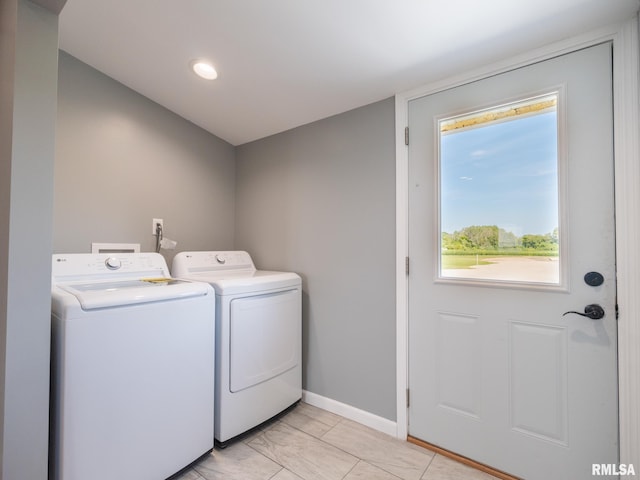 washroom with washing machine and dryer