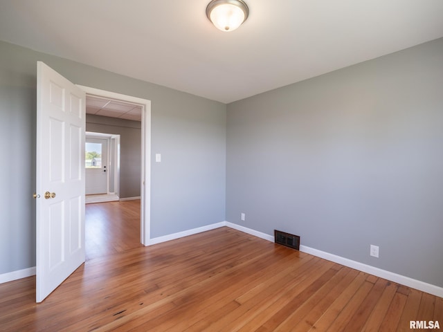 empty room featuring hardwood / wood-style floors