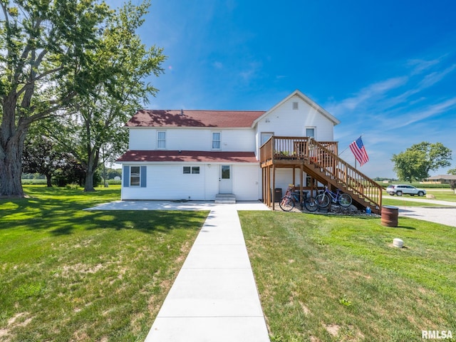 rear view of property featuring a yard