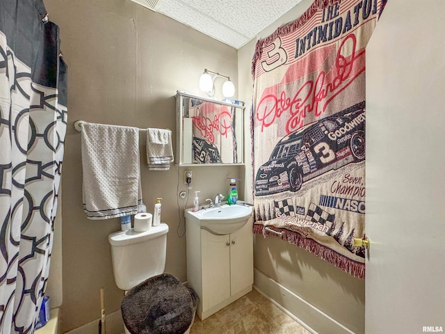 bathroom with vanity, toilet, and a shower with shower curtain