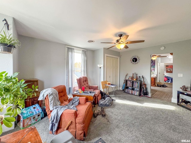 living room with carpet floors and ceiling fan