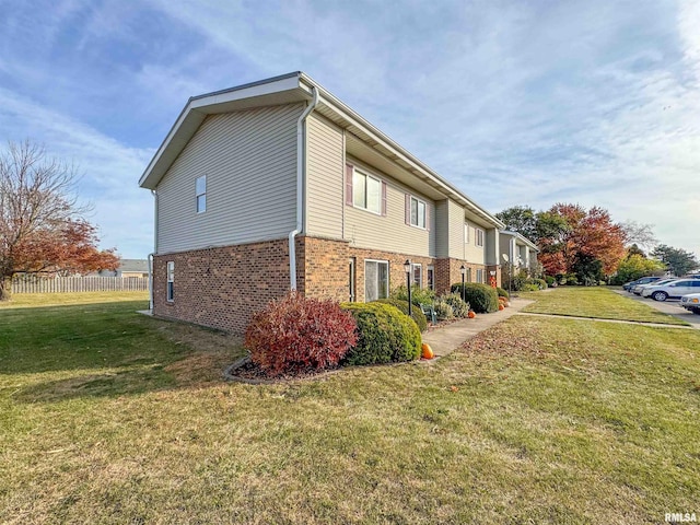 view of property exterior featuring a yard