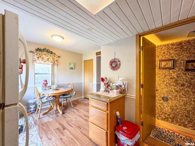 kitchen with white refrigerator and light wood-type flooring