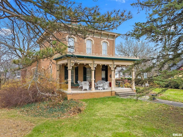 italianate house with covered porch and a front lawn