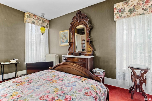 bedroom with carpet floors and radiator