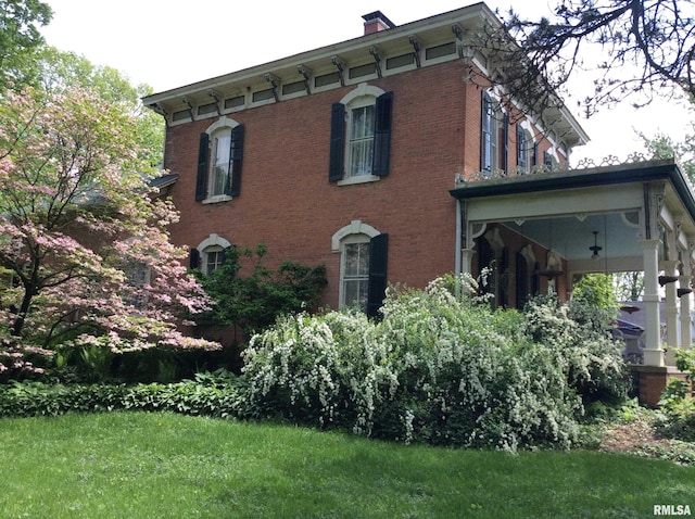 view of property exterior with a lawn