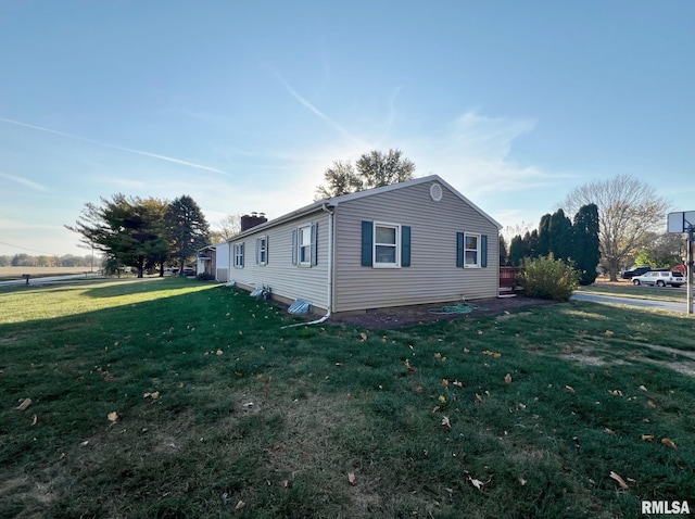 view of home's exterior featuring a yard