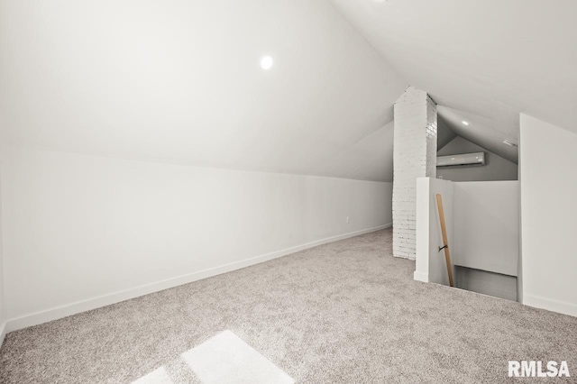 bonus room with a wall mounted air conditioner, carpet, and vaulted ceiling