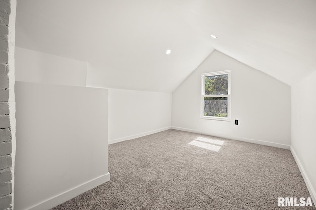 bonus room featuring carpet and lofted ceiling