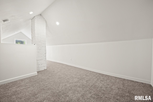 bonus room featuring lofted ceiling and carpet floors