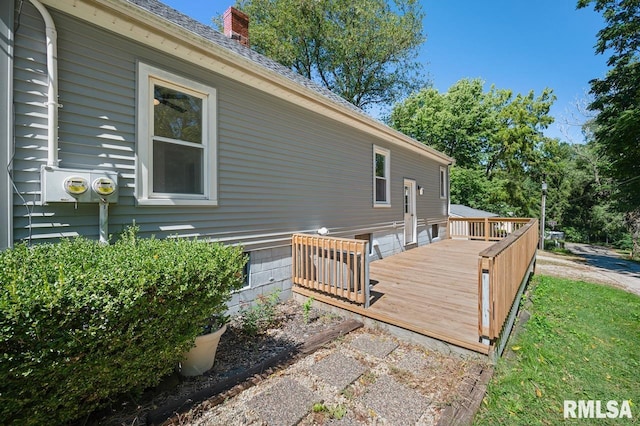 view of side of property featuring a wooden deck