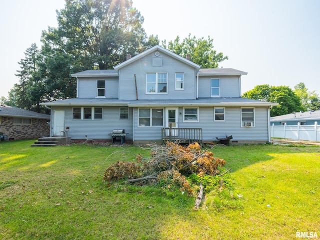 back of house featuring a yard