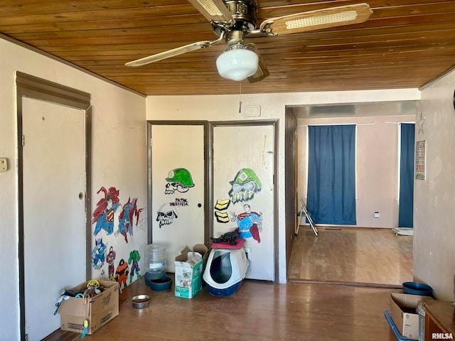 misc room with ceiling fan, wooden ceiling, and hardwood / wood-style floors